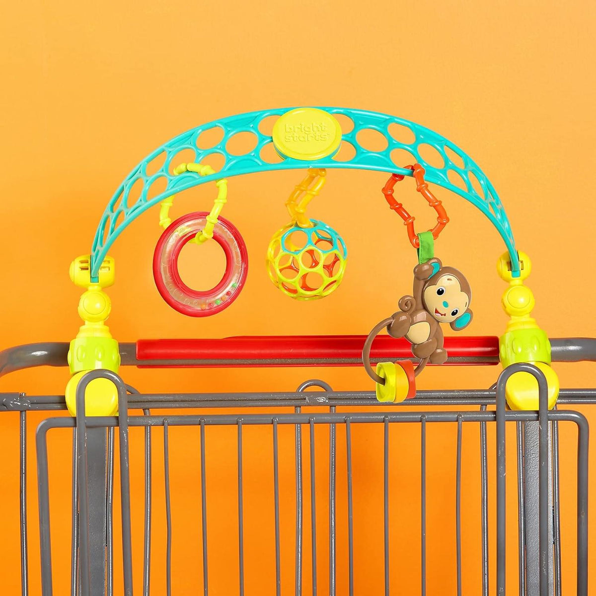 قوس أنشطة OBall Flex 'n Go من Bright Starts، لعبة قابلة للحمل لعربة الأطفال أو الحاملة، لحديثي الولادة+