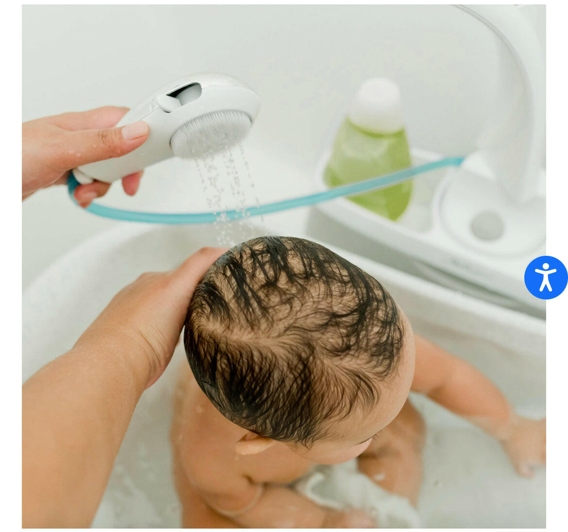 The First Years Rain Shower Baby Spa with Soothing Spray Showerhead.