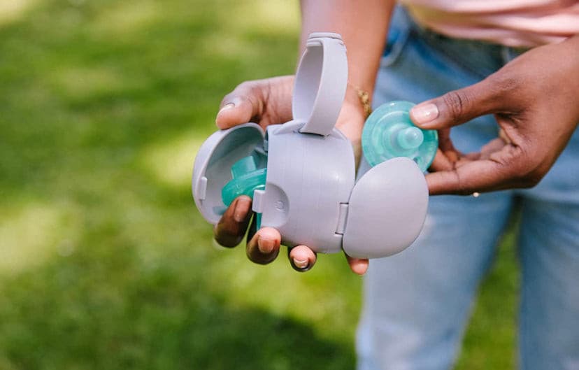 Ubbi On The Go Dual Pacifier Holder Keeps Baby’s Binkies Clean and Accessible Includes Silicone Strap, Grey.